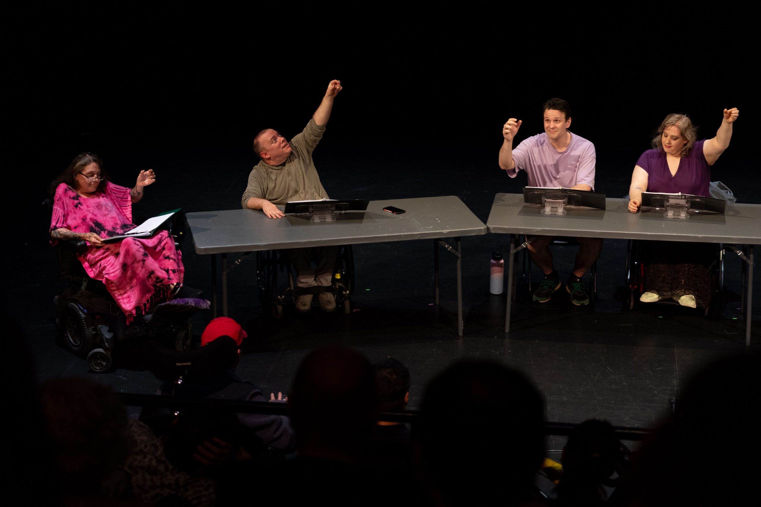 Staged Reading Photo from Saturday Nights At Axles - The cast raise imaginary glasses in a cheers.