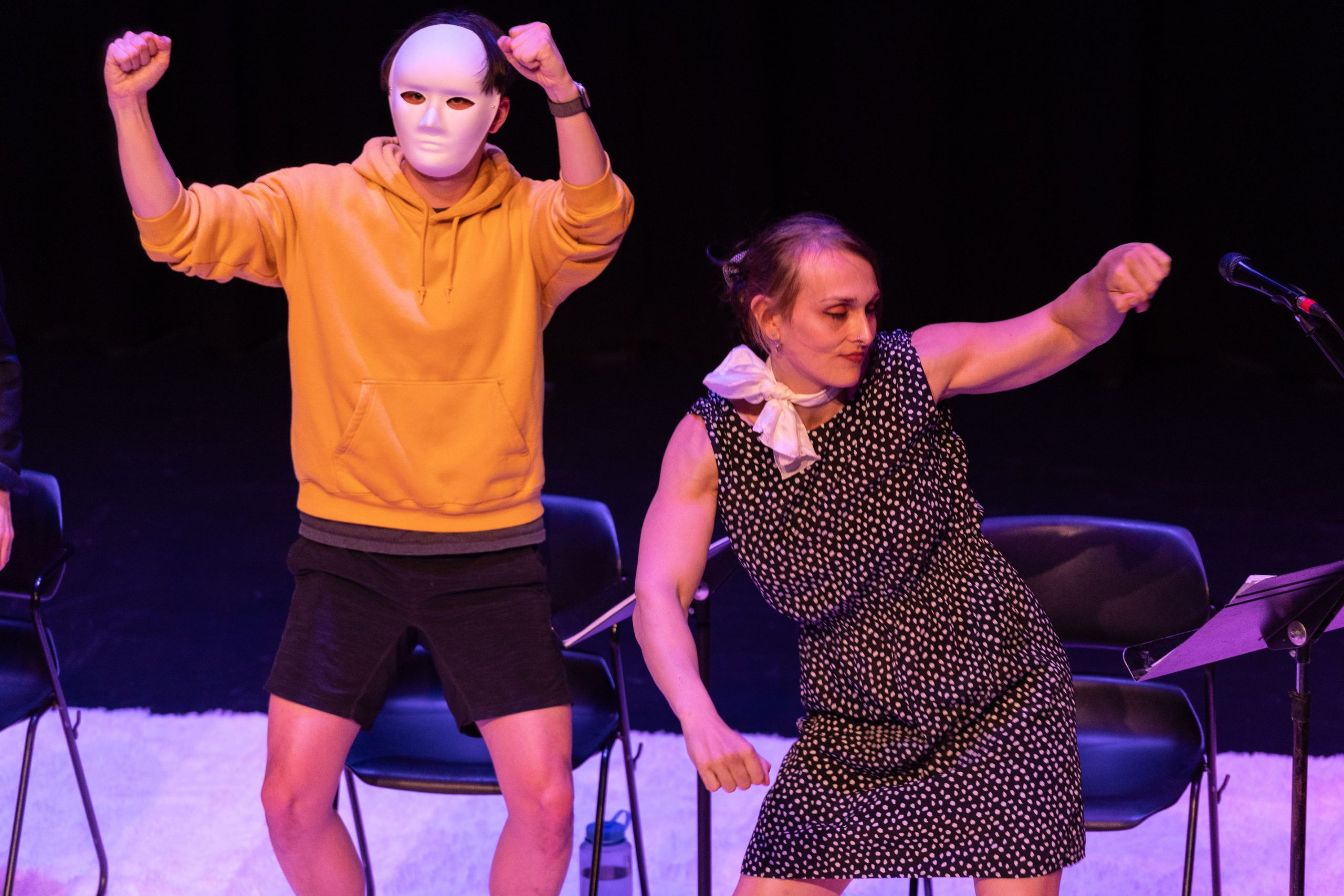 Staged Reading Photo from Faye's Room - Two actors dancing, one of them in a neutral white mask.