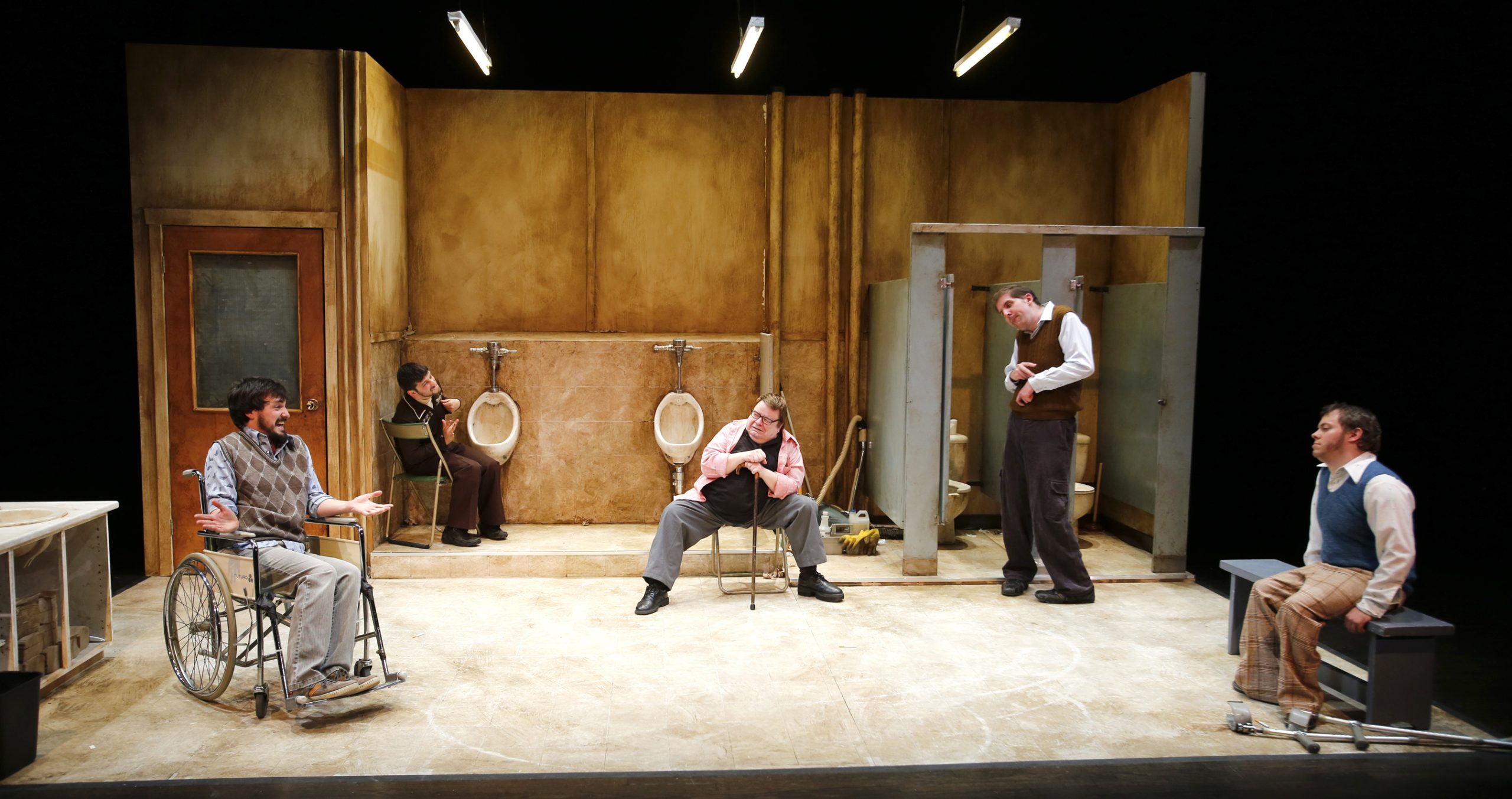 Production Photo from Creeps - Four actors in a dirty men's public bathroom set