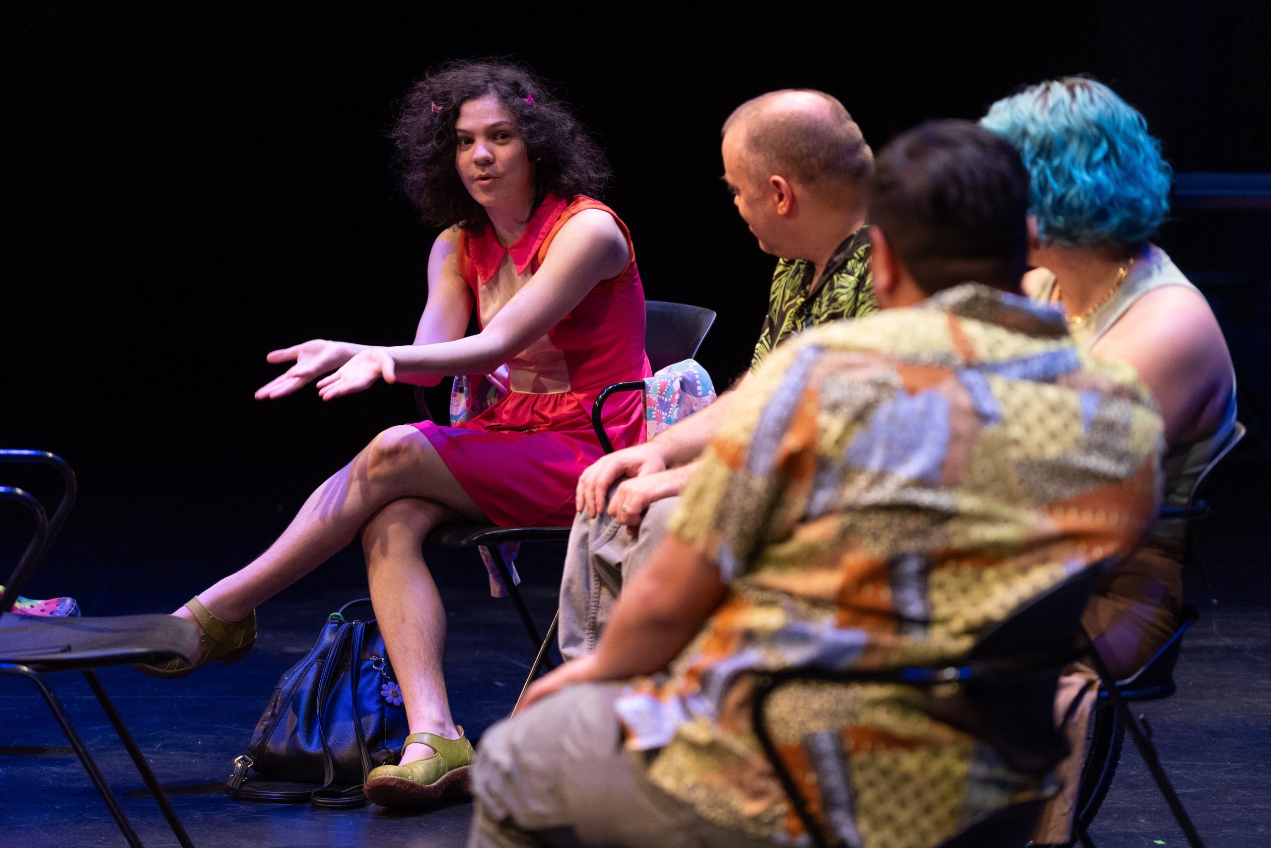 Photo from Playwrights' Panel - One playwright talking while the rest listen.