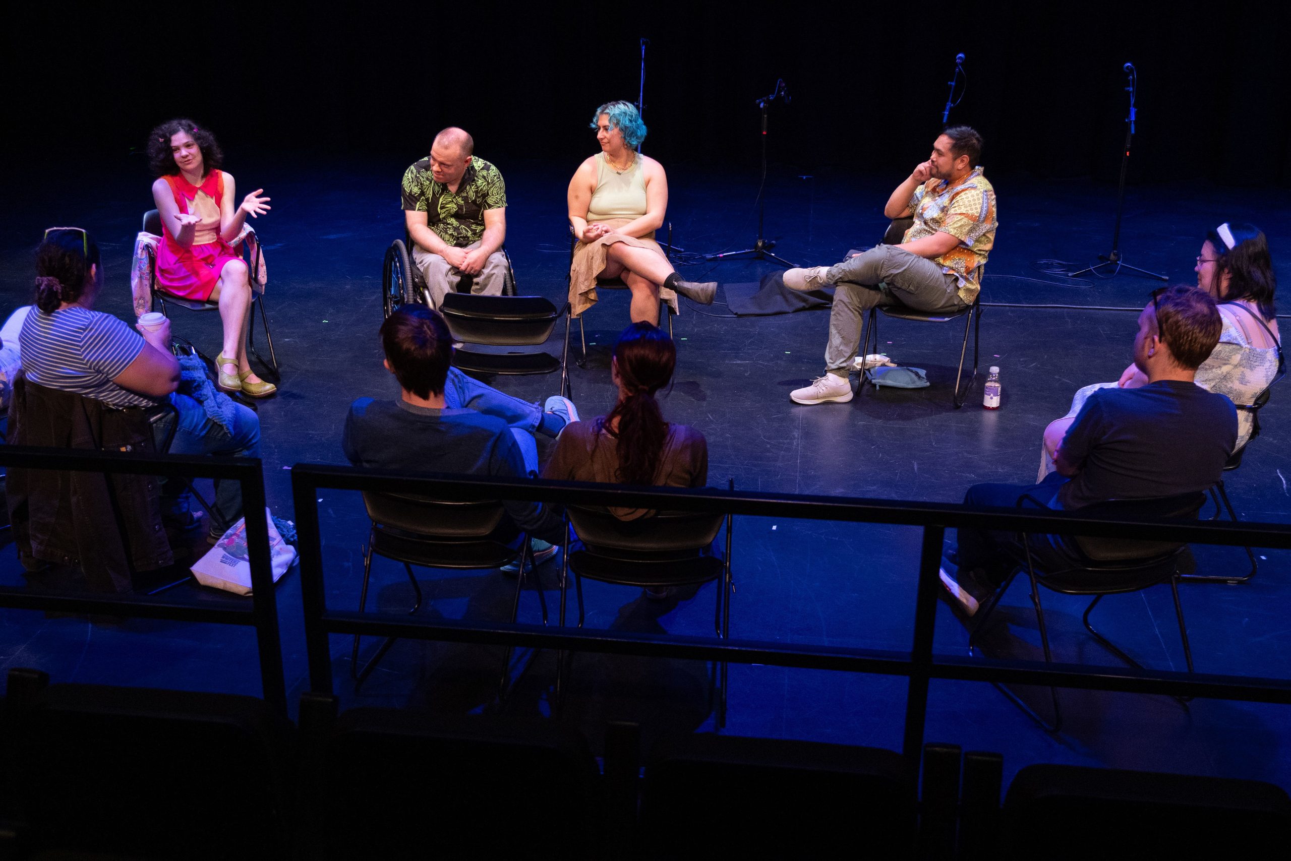 Photo from Playwrights' Panel - Playwrights sitting and talking in a circle with attendees.