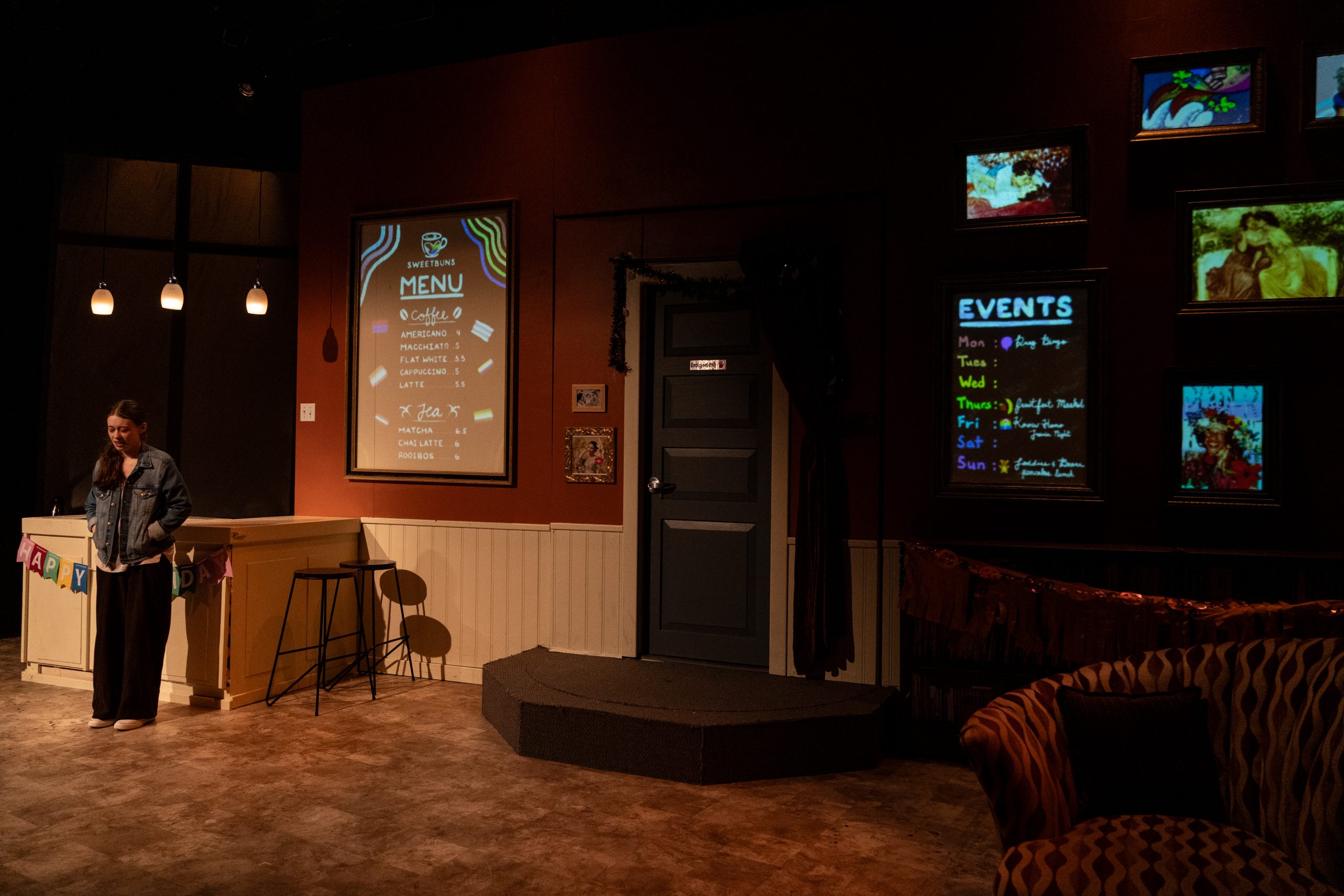 Production Photo of Faye's Room - An actor in a dark café set