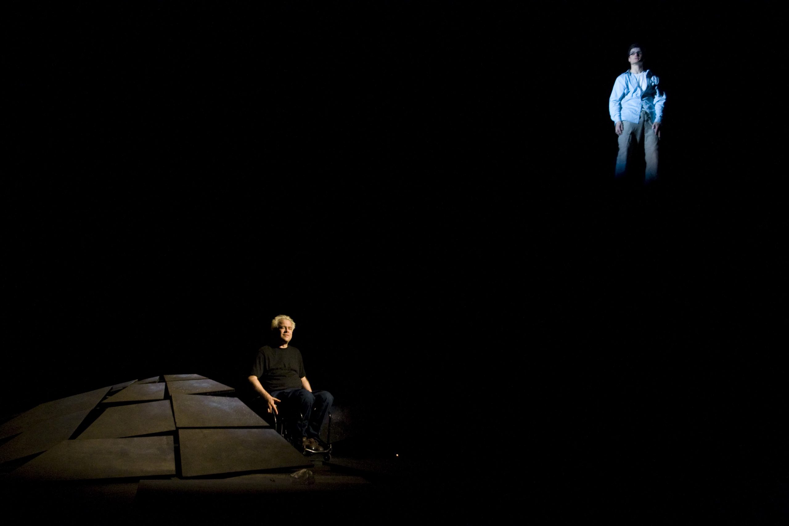 Production Photo from Skydive - Two actors, one in a wheelchair on the ground, the other floating in the air.