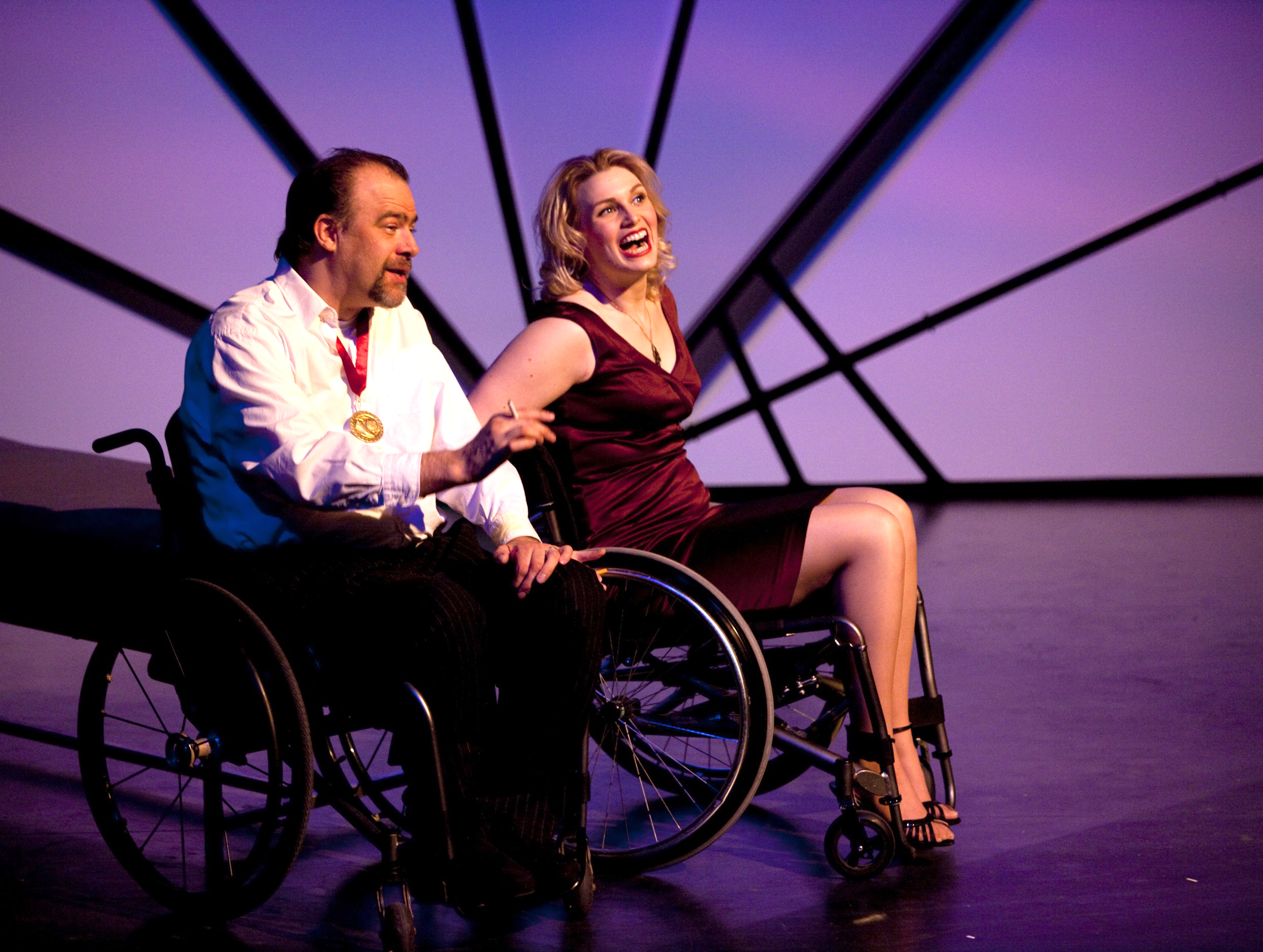 Production Photo from Spine - Two actors in wheelchairs onstage.