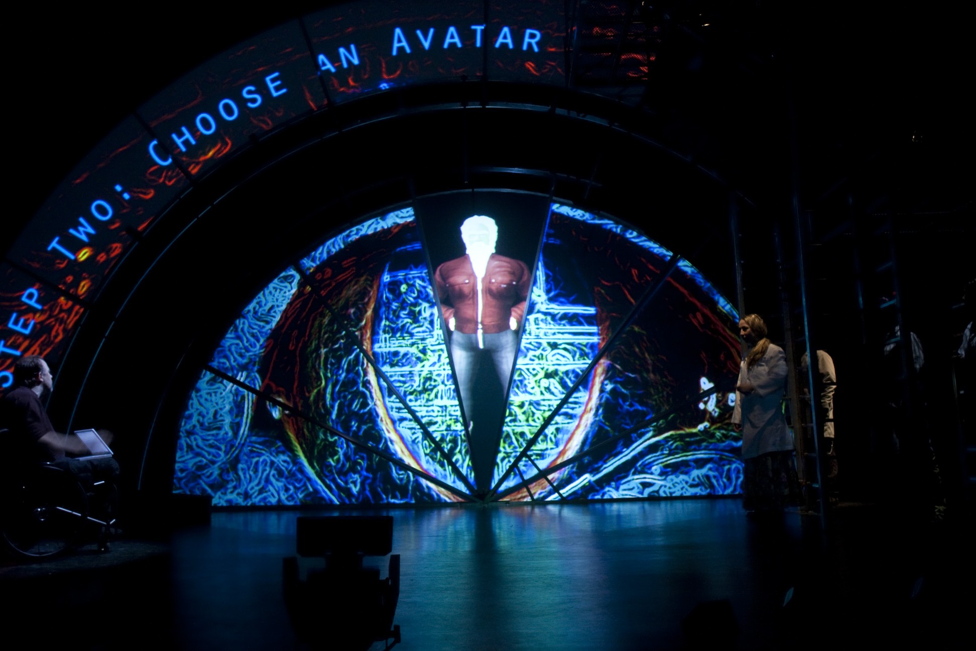 Production Photo from Spine - Projection Design with text that reads: "Step Two: Choose an Avatar"