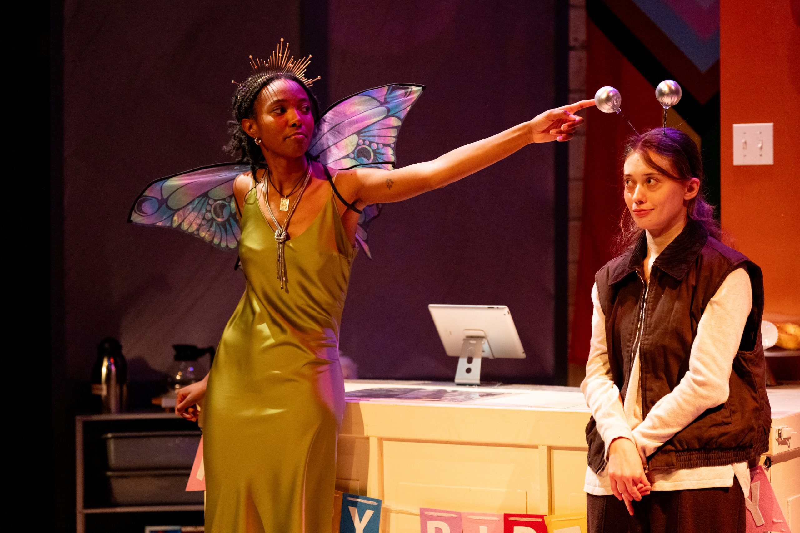 Production Photo of Faye's Room - Two actors in Halloween costumes flirting with each other.